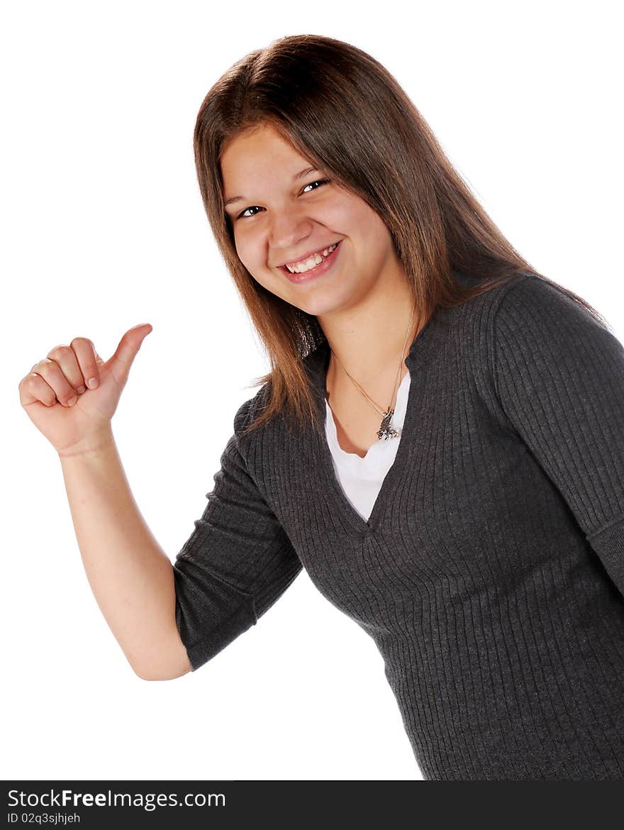 A happy young teen pointing behind with her thumb.  Isolated on white. A happy young teen pointing behind with her thumb.  Isolated on white.