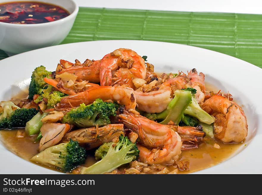 Fried broccoli with prawn .