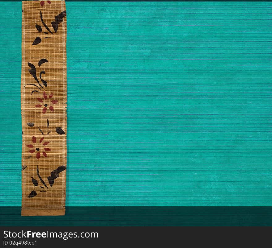 Flower bamboo banner on aquamarine ribbed wood