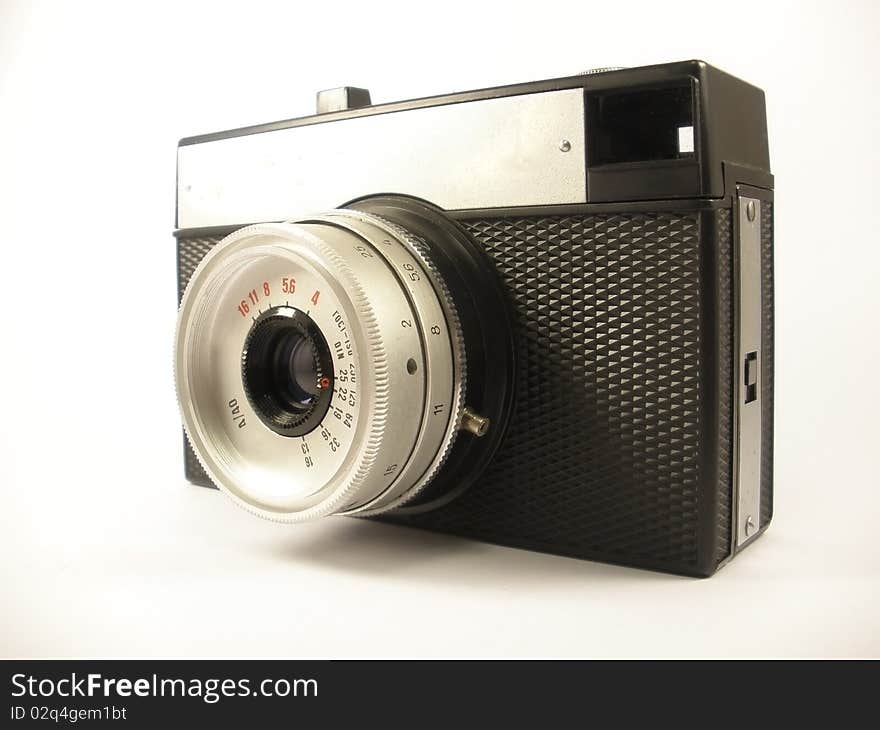 Vintage photo camera on the white isolate background