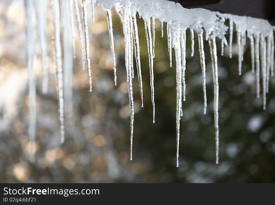 Close Up Of Icicles Hanging From Roof