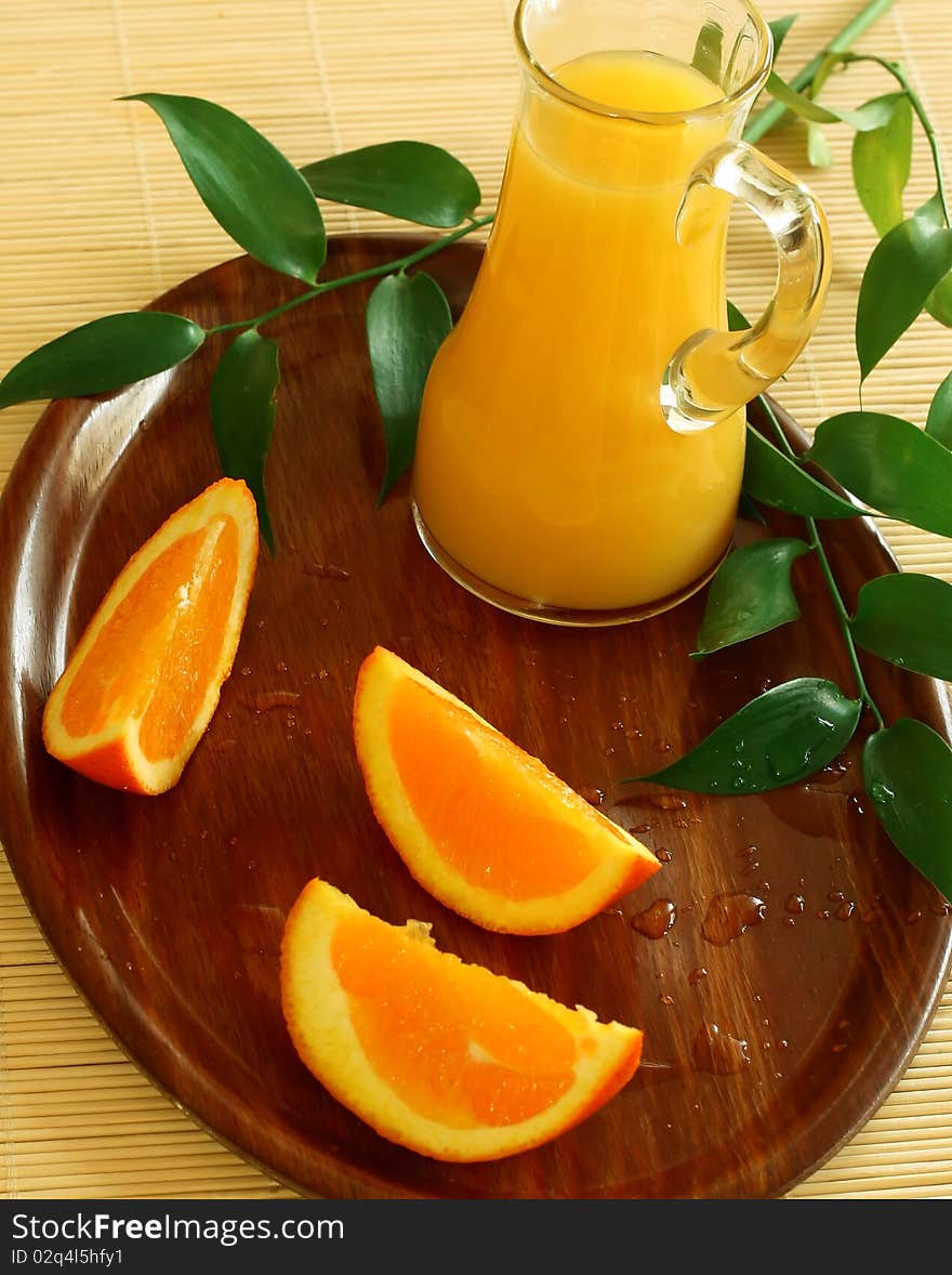 Fresh Oranges And Orange Juice In Glass