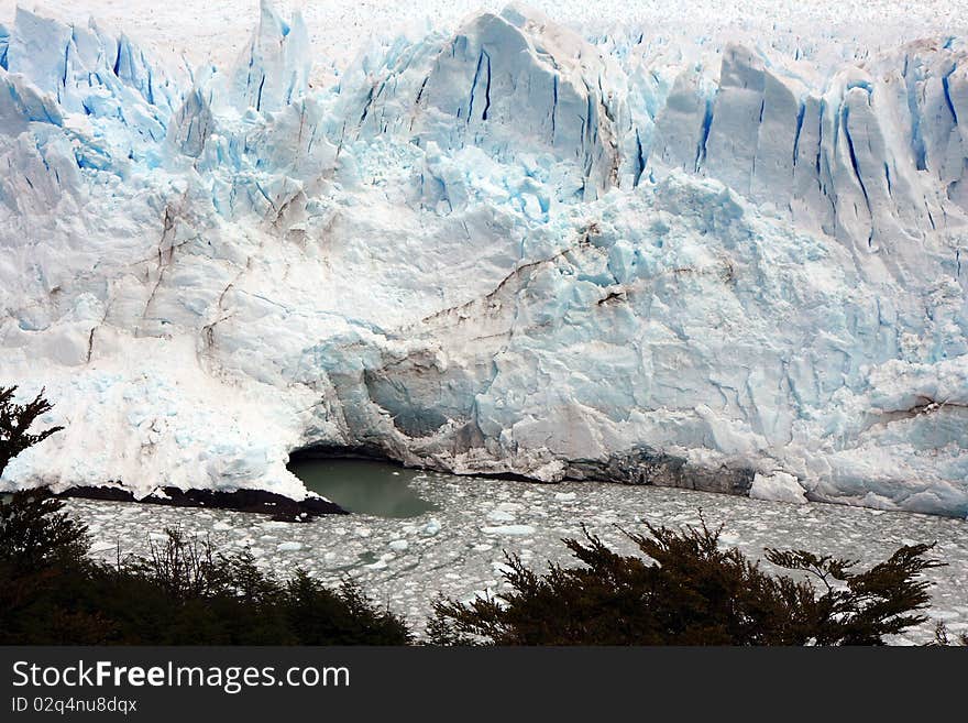 View to the glacier with an ice cave. View to the glacier with an ice cave