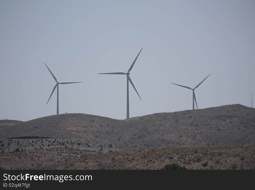 Three wind turbines on a hill in Almeria province, Spain