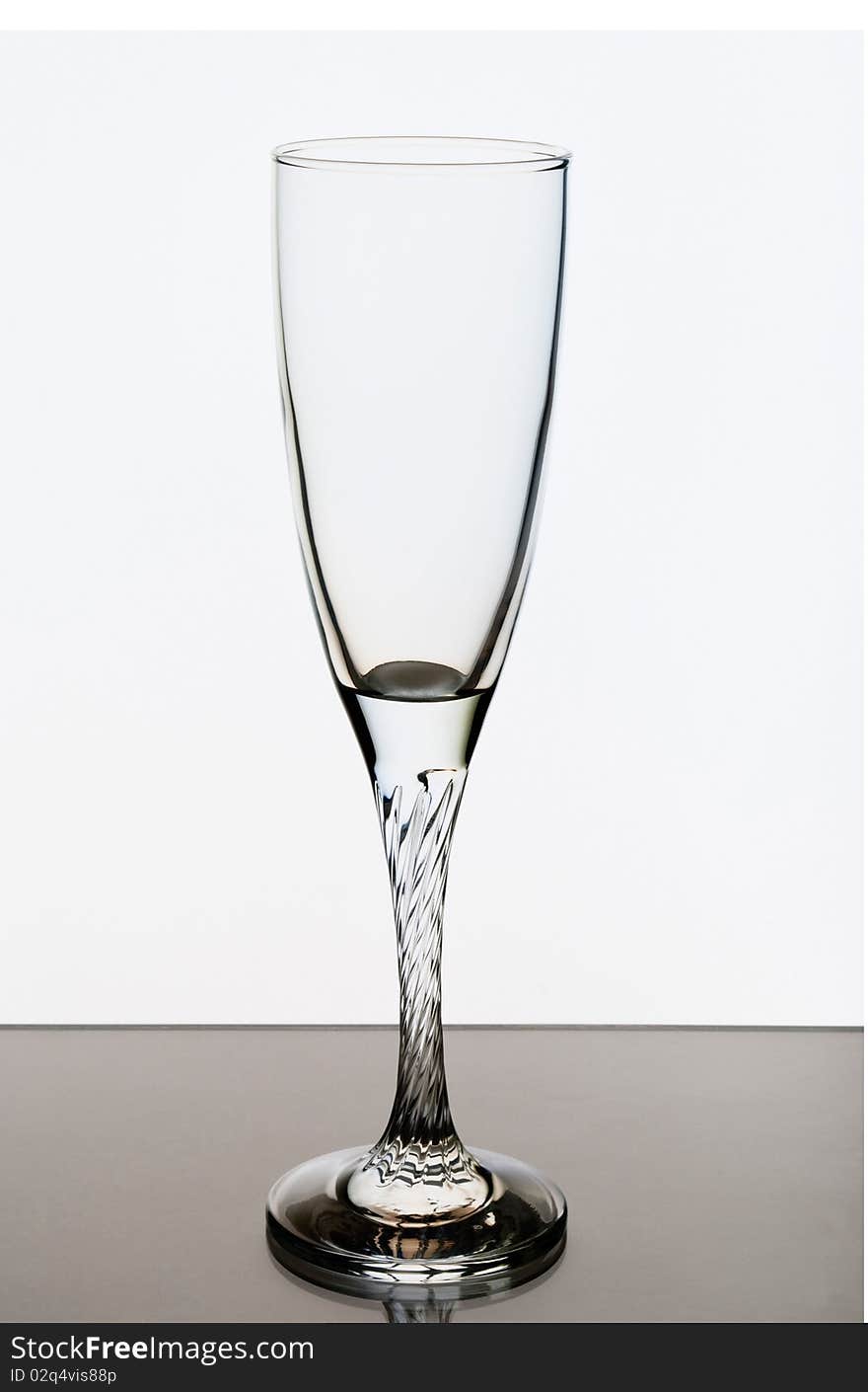 An empty glass on a white background, lighting konrovoe. An empty glass on a white background, lighting konrovoe