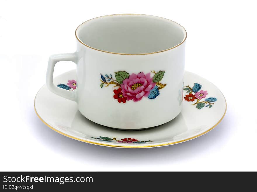 Floral tea cup and saucer on a white background. Floral tea cup and saucer on a white background