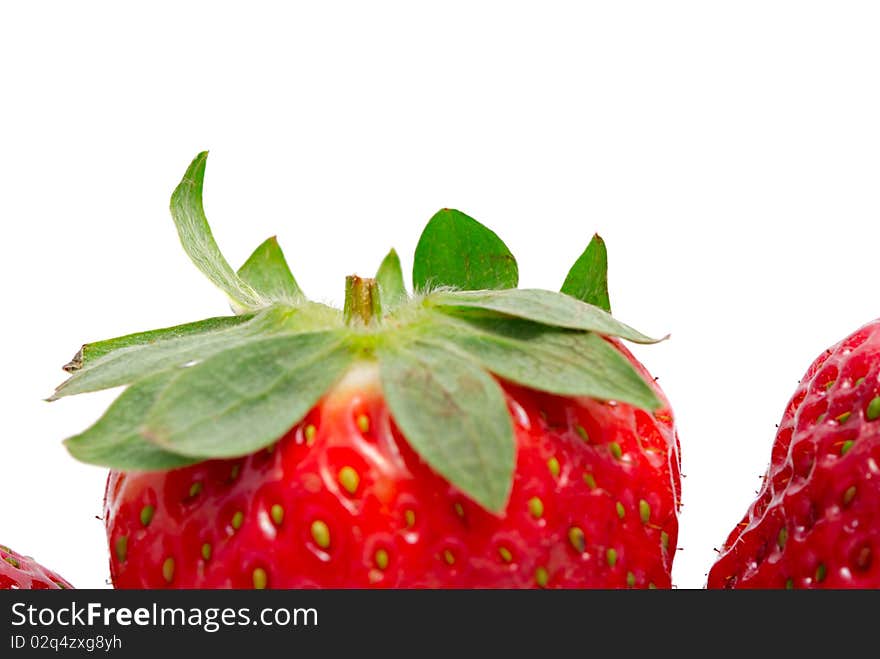 The strawberry on a white background close up.