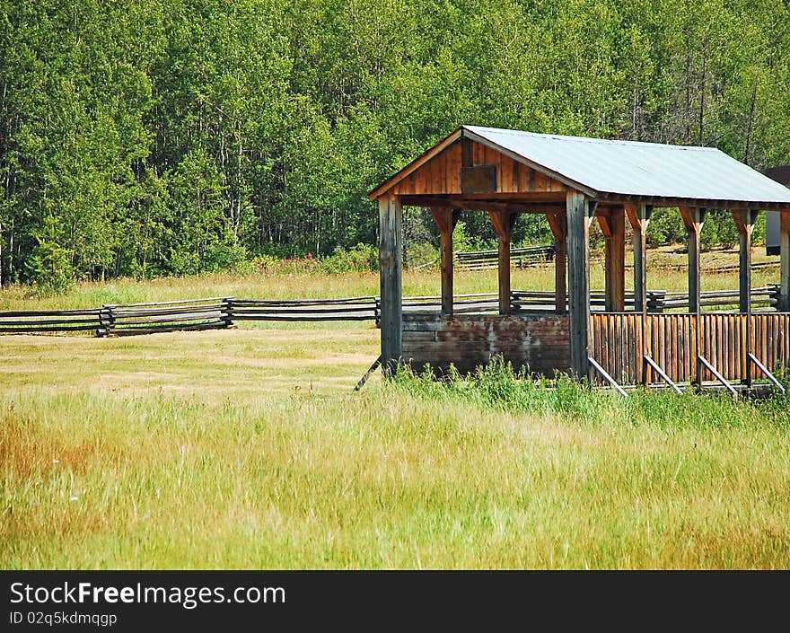 Old covered bridge in green meadow