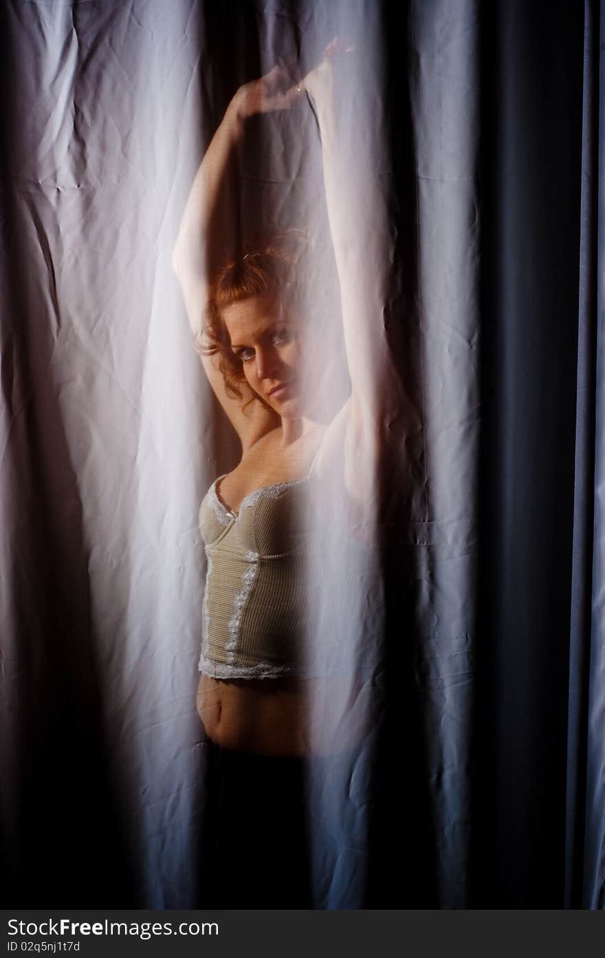 Beautyful woman standing behind the silk cloth. Beautyful woman standing behind the silk cloth