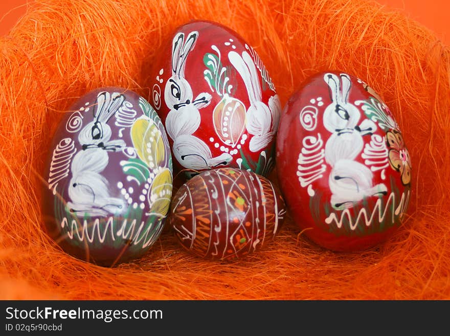 Easter with easter eggs in an orange composition