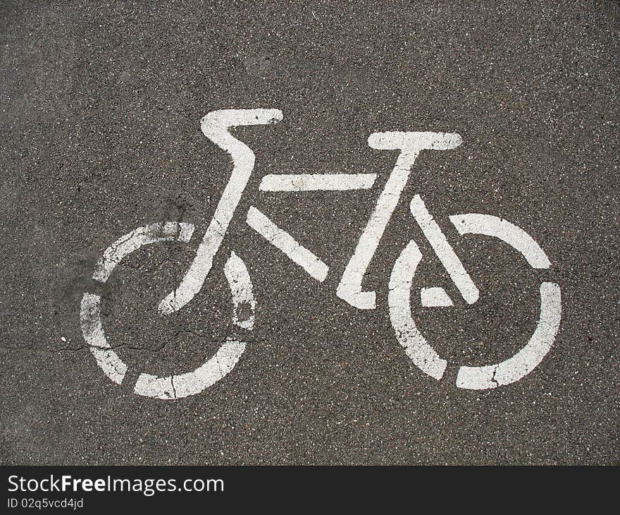 Urban bicycle symbols on the asphalt track. Urban bicycle symbols on the asphalt track