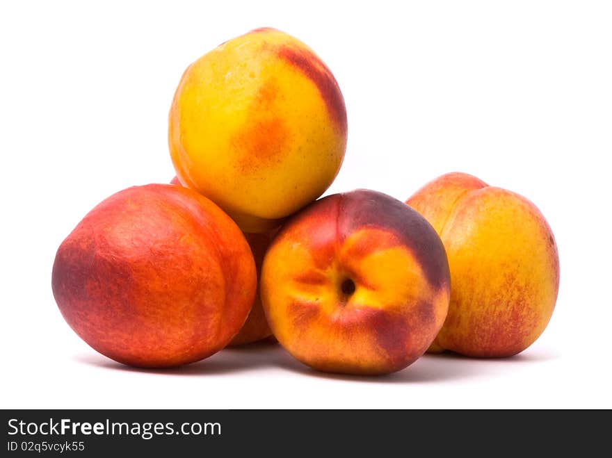 Juicy nectarines on a white background