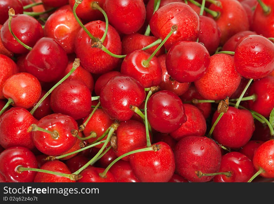 Background sweet ripe cherry close. Background sweet ripe cherry close