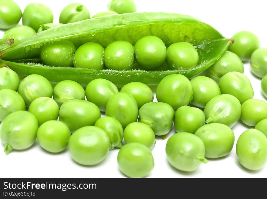 Fresh green peas isolated on white