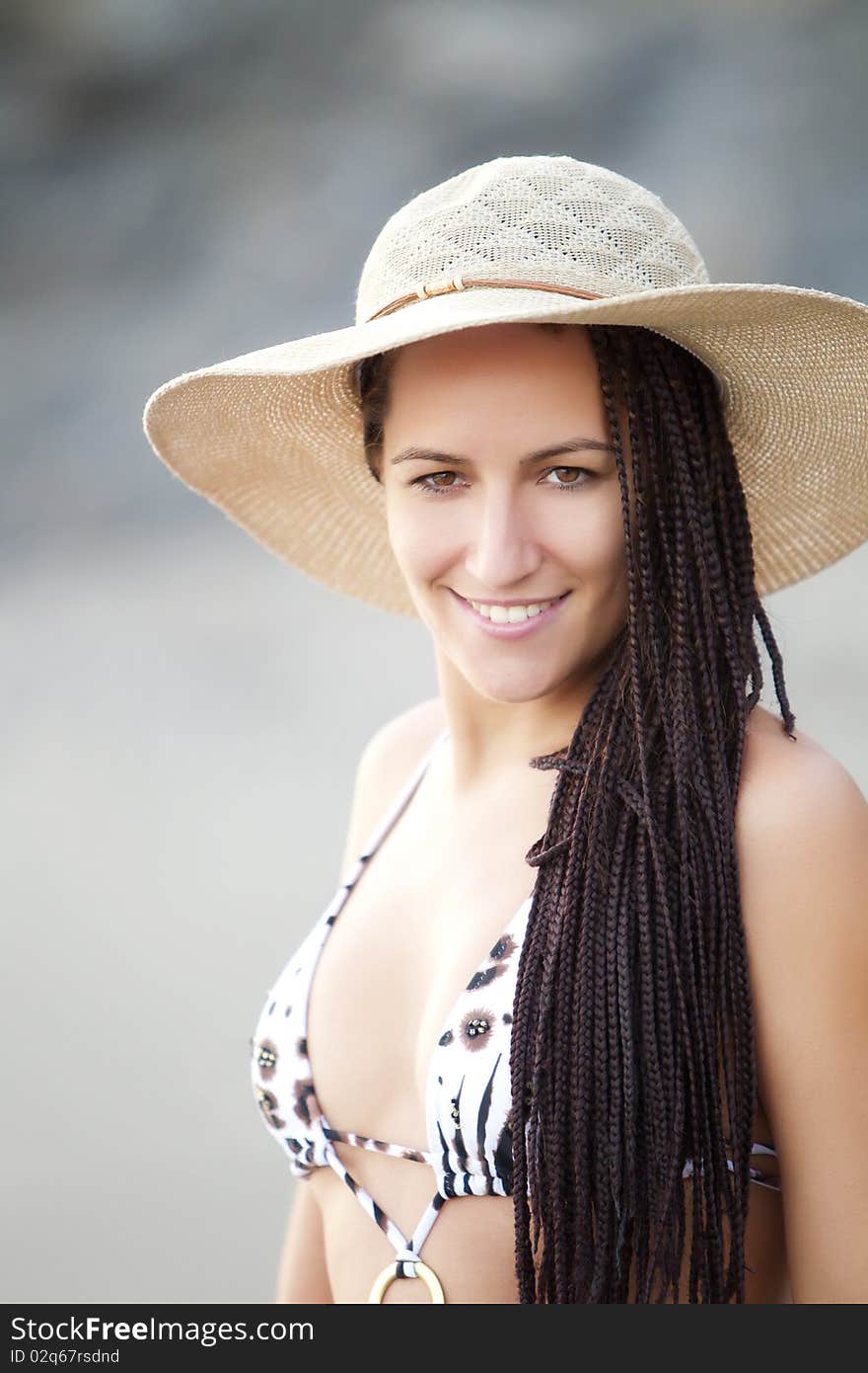 Young smiling female wearing a hat. Young smiling female wearing a hat.