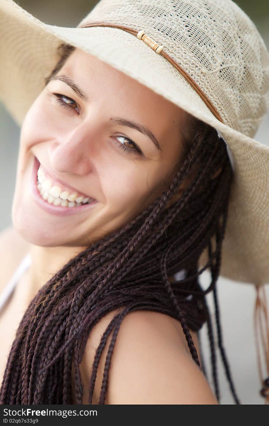 Young smiling female wearing a hat. Young smiling female wearing a hat.