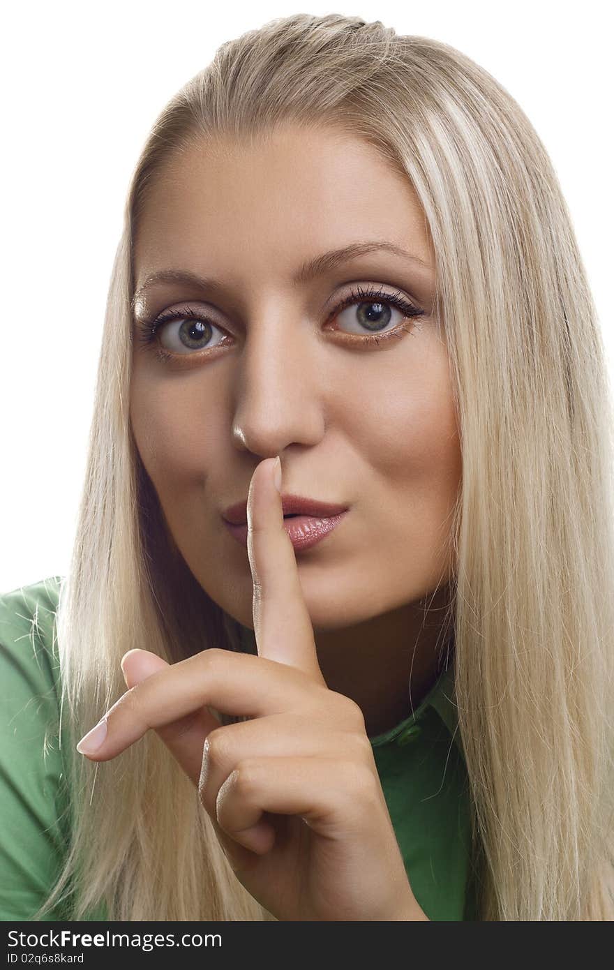 Shh. secret - Young girl with her finger over her mouth