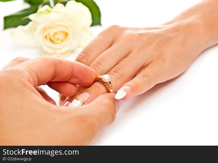 Man's and woman's hands with golden ring. White background. Man's and woman's hands with golden ring. White background