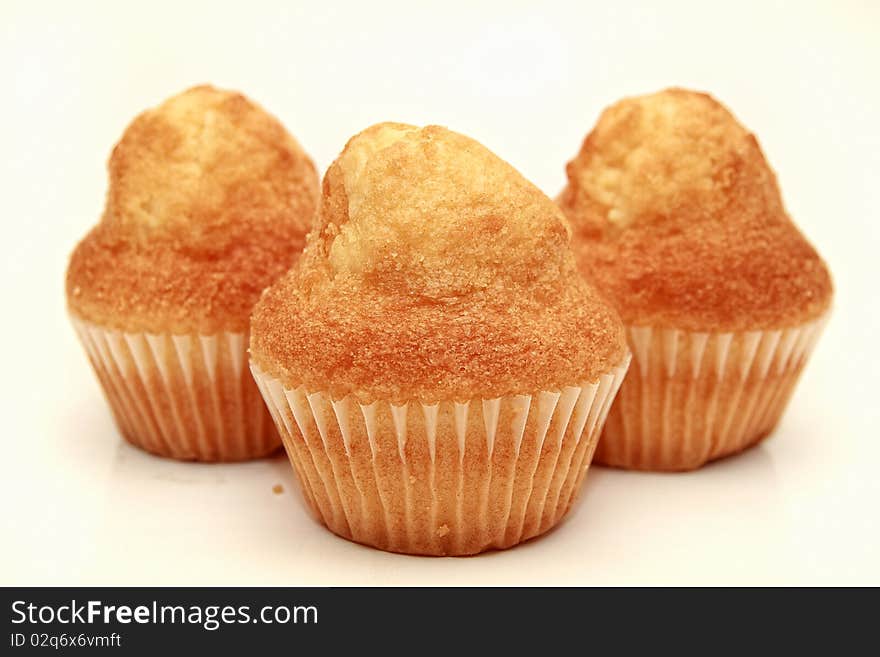 An image of three muffins over white background