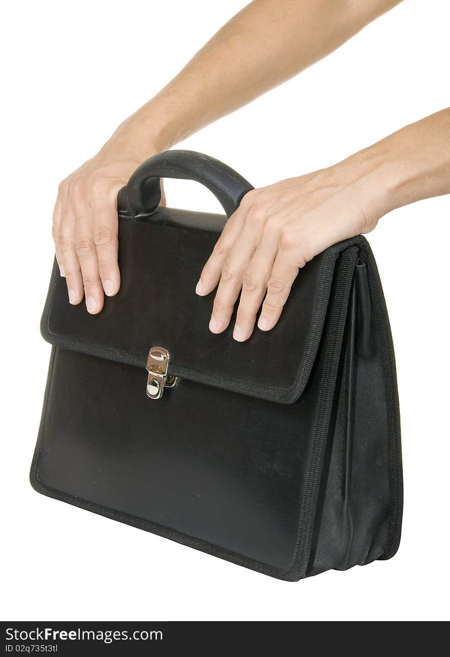 Hand holding a black briefcase