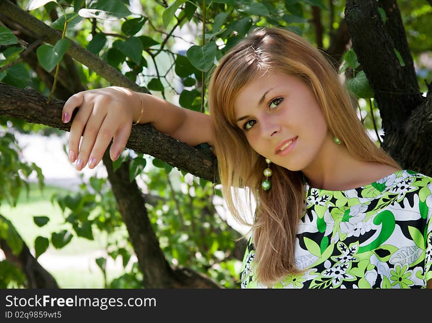 Beautiful young woman at the tree. Beautiful young woman at the tree