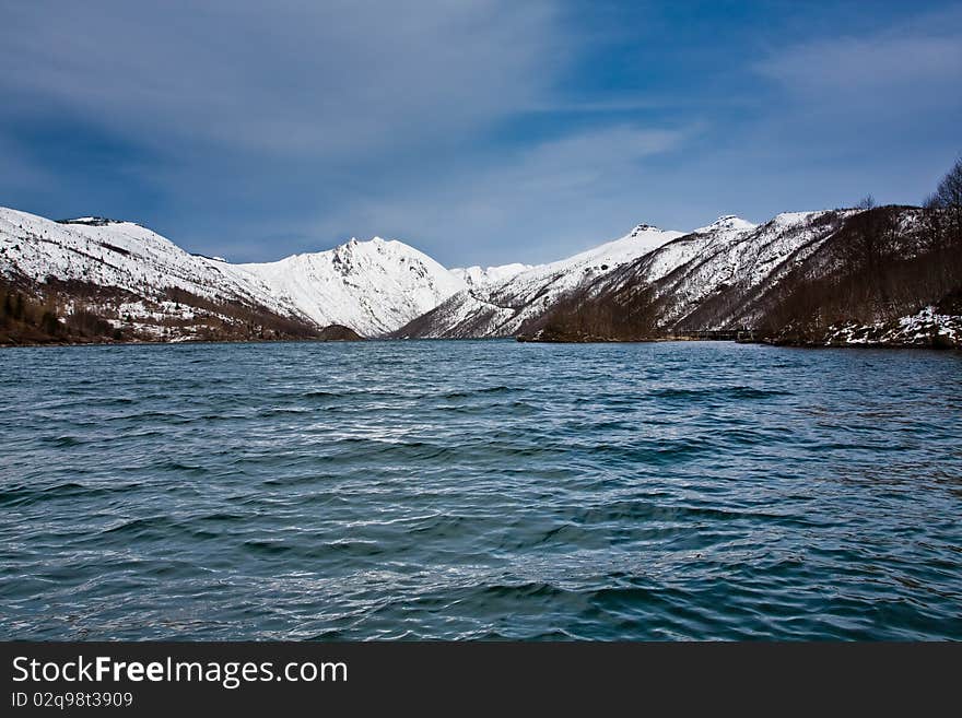 Lake in front of a snowy mountain