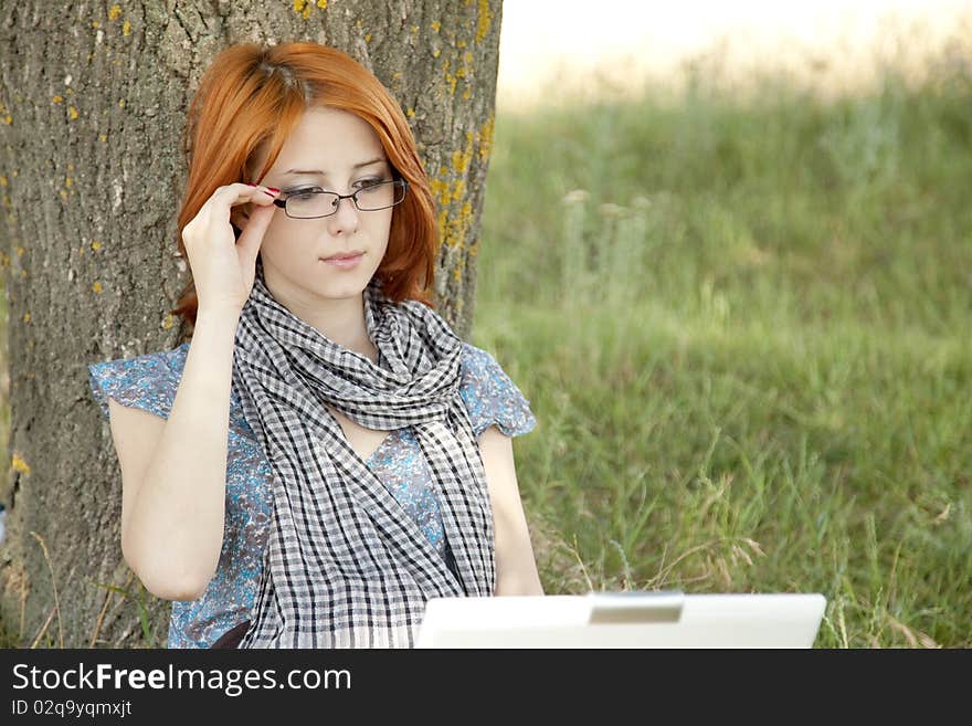 Young Girl In Glasses And Notebook