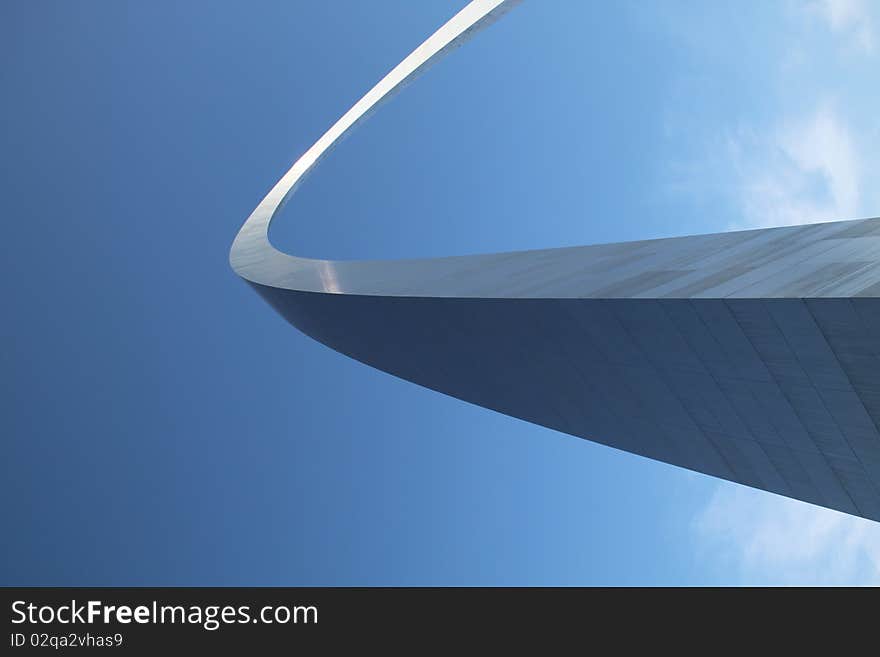 The Arch at St. Louis as if extending into sky.