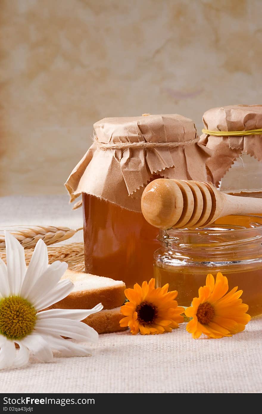 Several flowers and honey on bagging