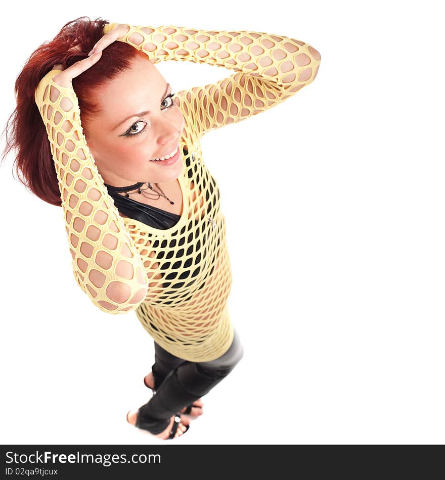 Young beautiful fashion model with red hair and a fishnet shirt. Young beautiful fashion model with red hair and a fishnet shirt.