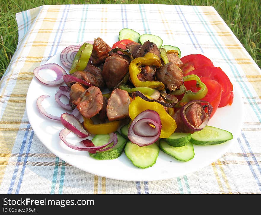 Cooked meat with carrot onion and lemon slices barbecue food. Cooked meat with carrot onion and lemon slices barbecue food