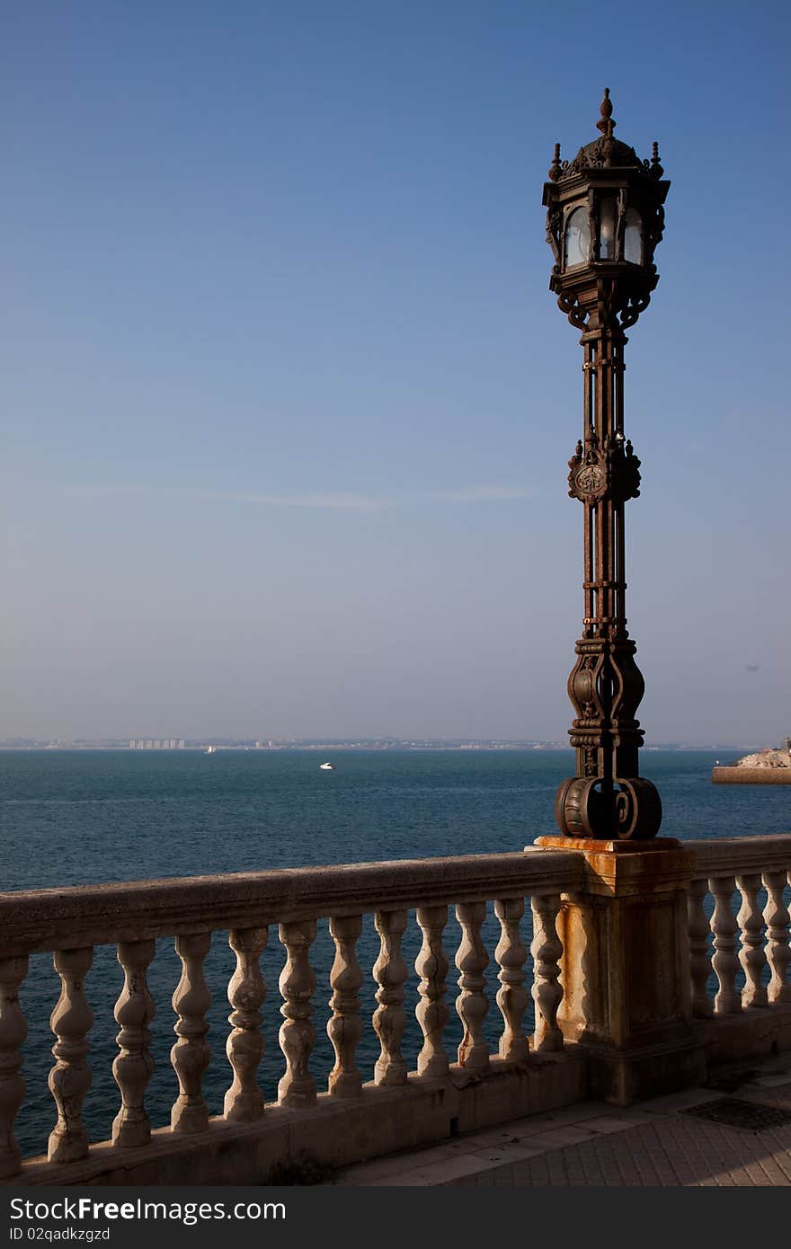 Light post in the board walk in Cadiz, Spain