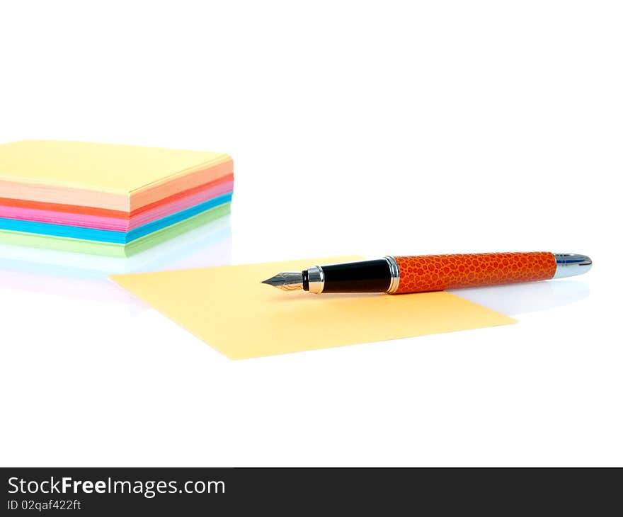 Colorful empty notes and pen isolated on a white background. Colorful empty notes and pen isolated on a white background