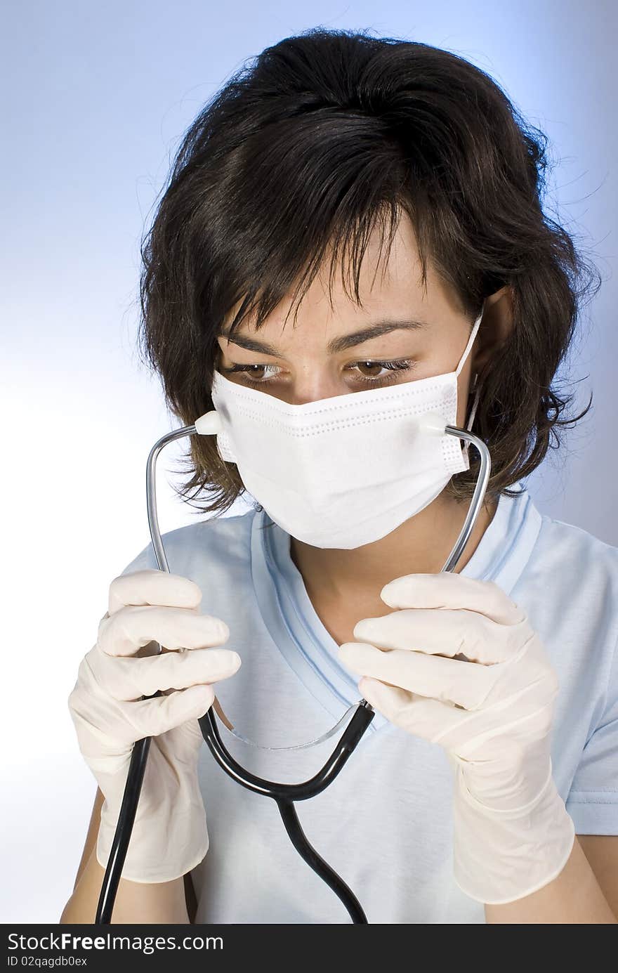 Doctor with stethoscope. Isolated over white background