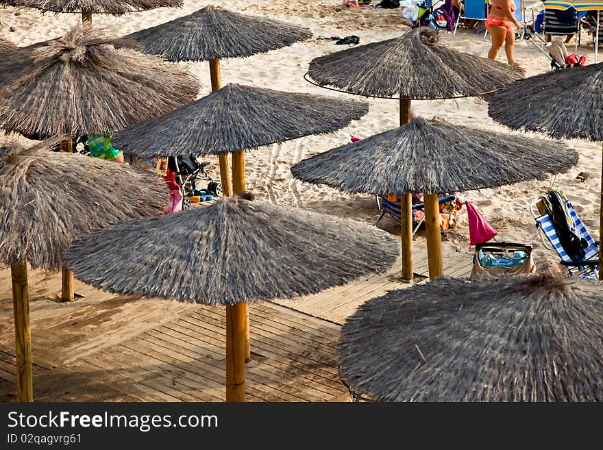 Sunshades at a crowded beach in Cadiz, Spain. Sunshades at a crowded beach in Cadiz, Spain