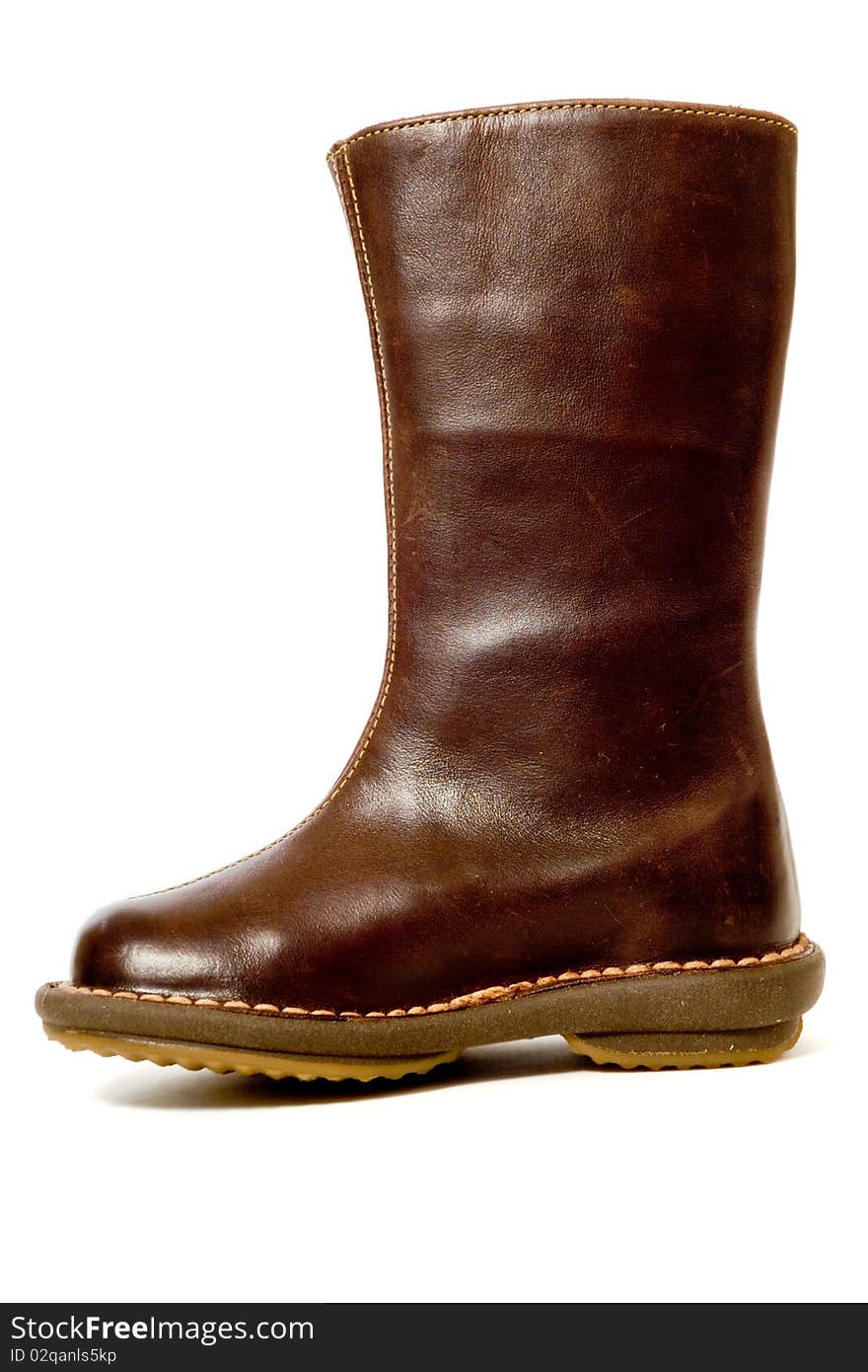 A brown high boot. Taken on a white background.