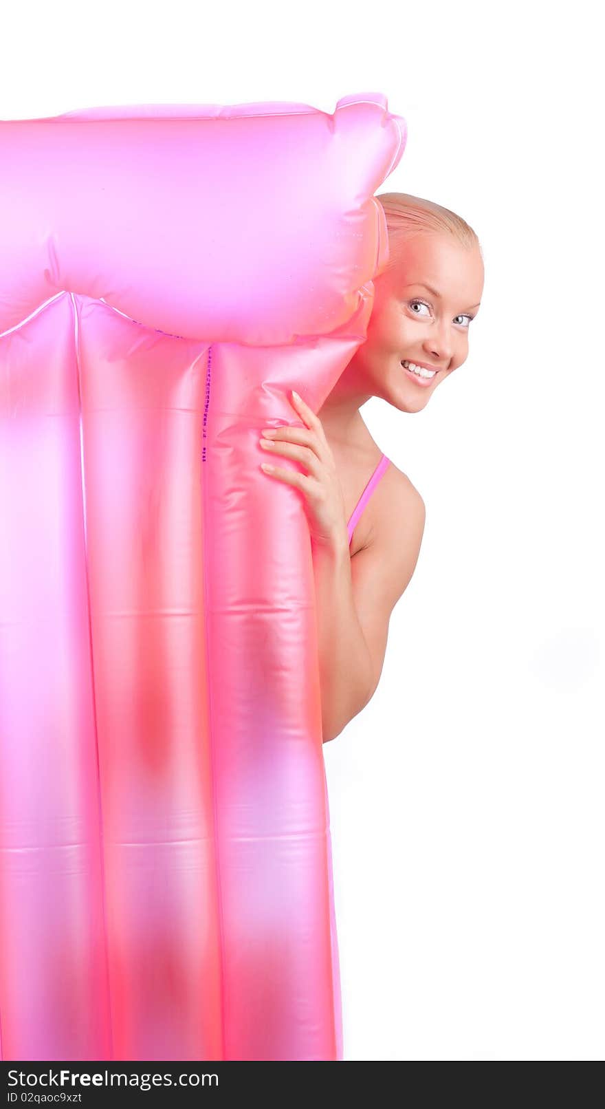 Cute happy girl with her pink mattress. Cute happy girl with her pink mattress