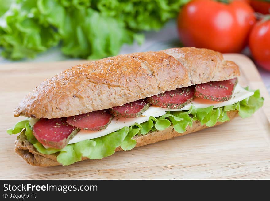 Fresh sandwich with dry meat and cheese on dietetic bread