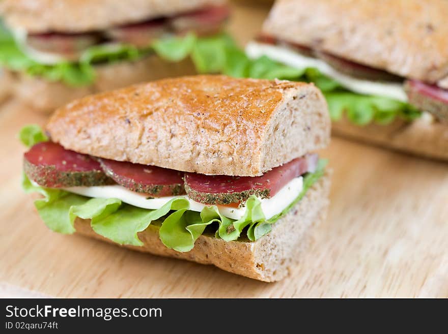 Delicious  homemade sandwich on wooden cutting board