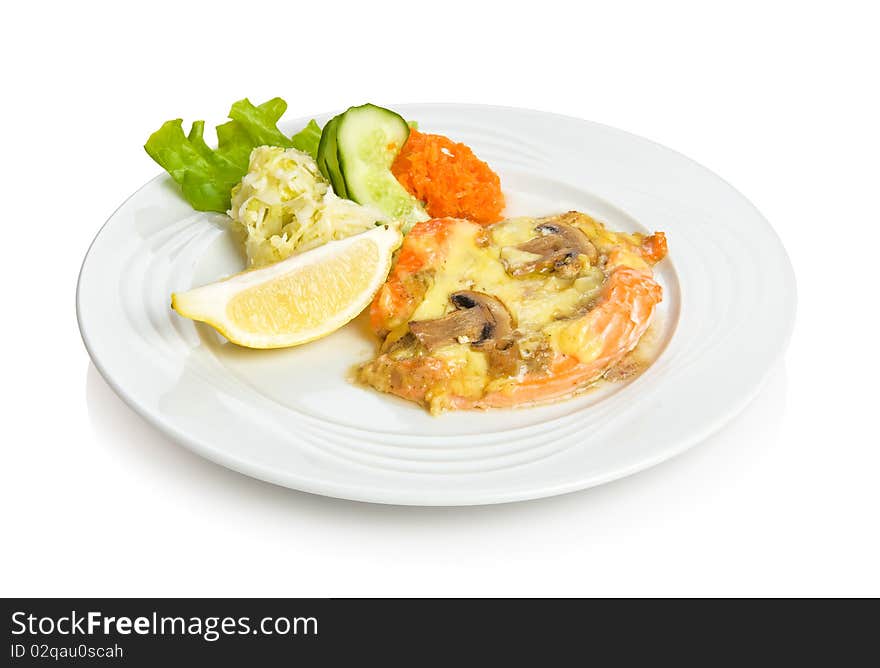 Fried trout steak with mushroom sauce. Isolated on white by clipping path.