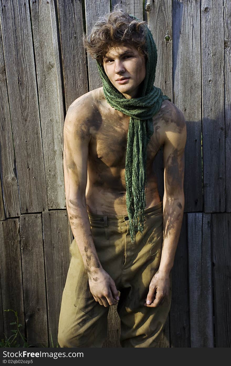 Young handsome male model posing outdoors