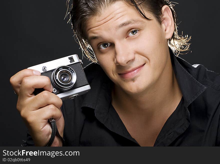 Man holding a photo camera. Man holding a photo camera