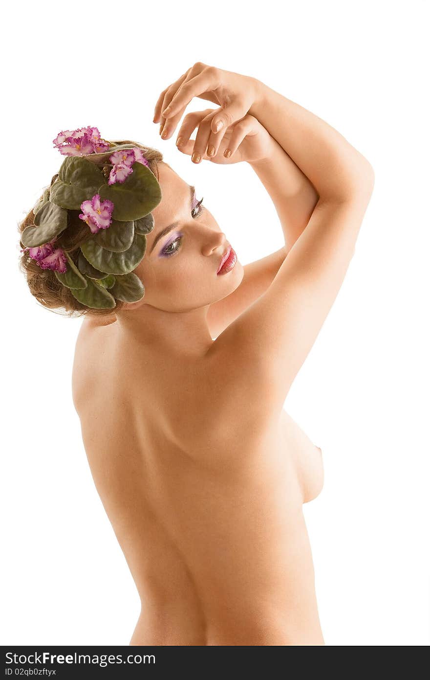 Nude girl with a wreath of flowers on her head