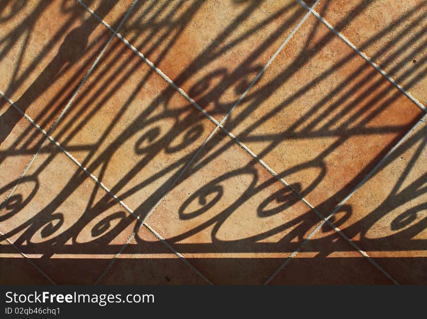 Shadows on tiled patio