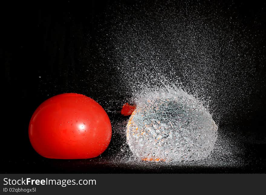 Inflatable balloon full of water broke and sprayed water. Inflatable balloon full of water broke and sprayed water