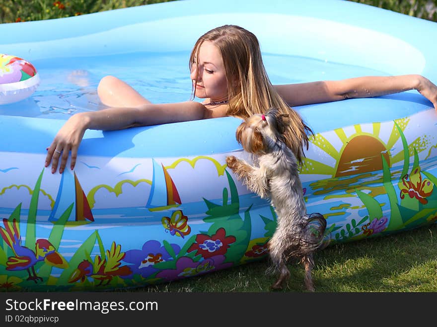 Portrait of a beautiful happy woman in swimming pool