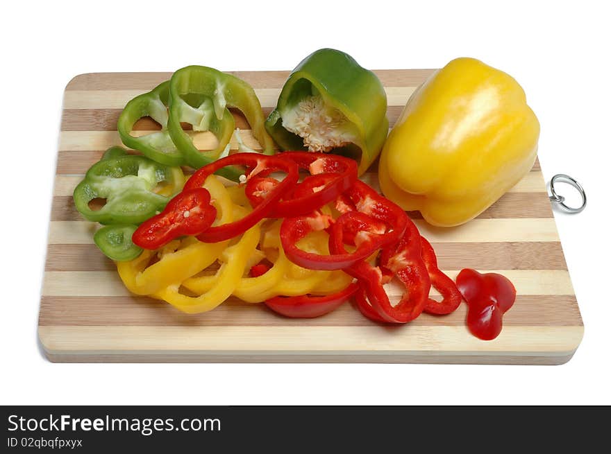 Fresh tasty pepper slices on a kitchen board. Fresh tasty pepper slices on a kitchen board