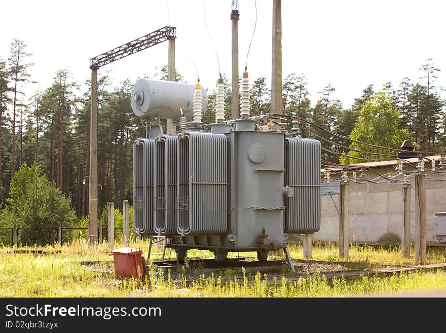 The powerful high-voltage transformer on city substation. The powerful high-voltage transformer on city substation