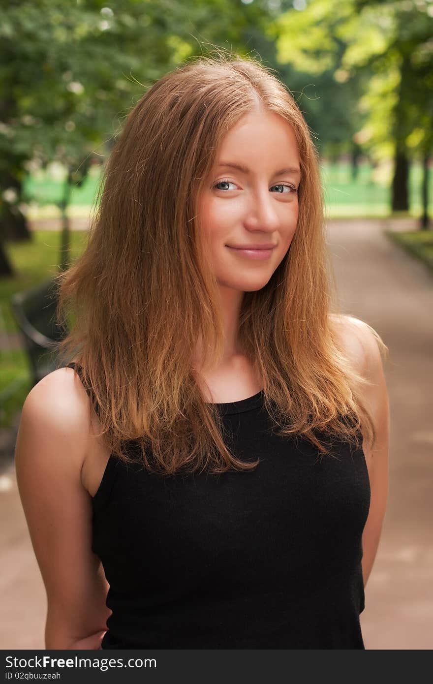 Beautiful young woman in a park