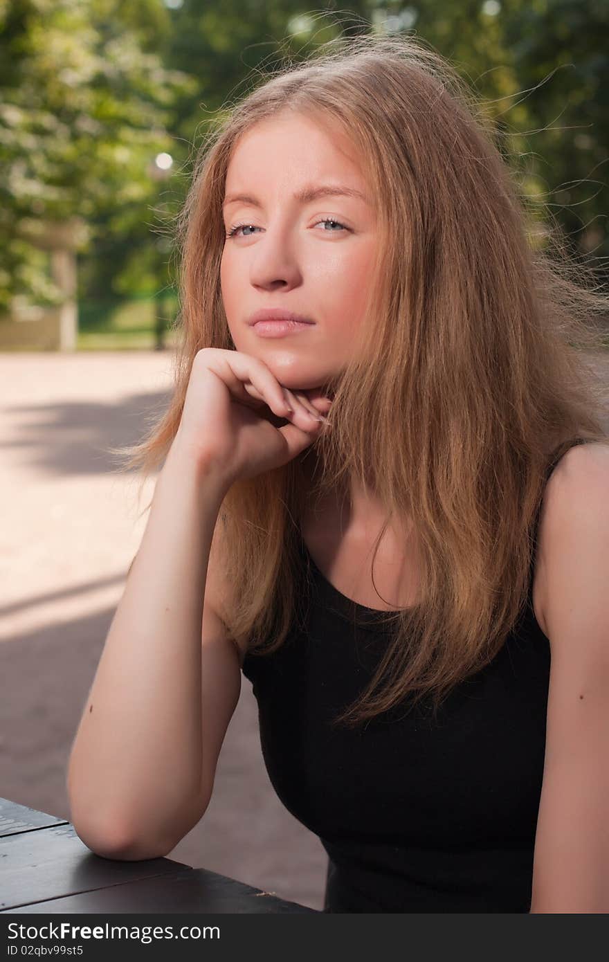 Beautiful young woman in a park